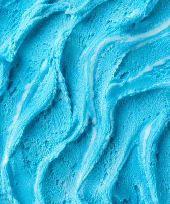Bright teal-blue bubblegum gelato in a glossy swirled texture close-up