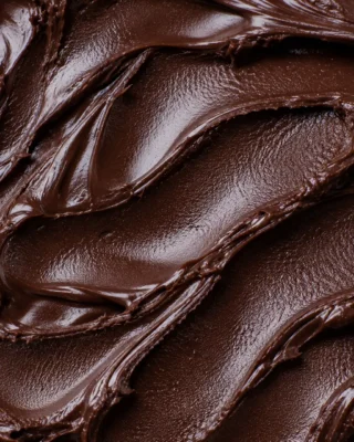 Rich deep brown dark chocolate gelato with a glossy swirled surface