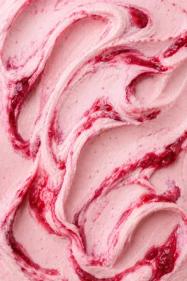 Pale pink raspberry ripple gelato laced with deep red fruit ribbons