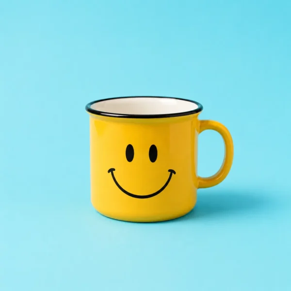 Yellow smiley-face mug with a handle centered on a deep blue background