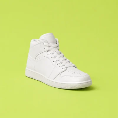 White canvas high-top sneaker centered on a flat lime-green background