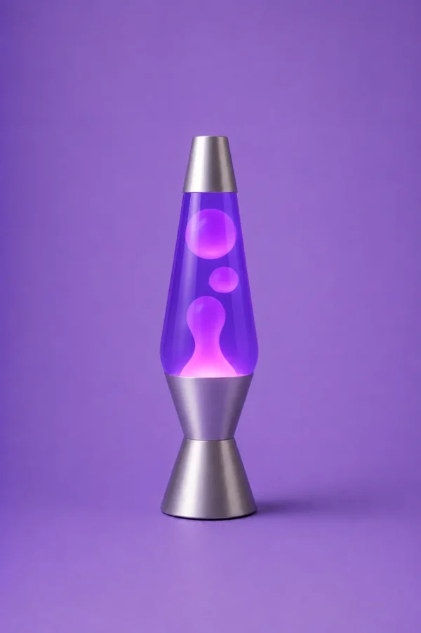 Purple lava lamp glowing against a two-tone blue and pink studio background