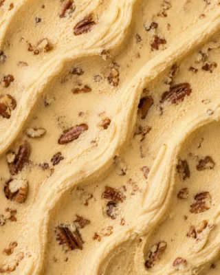 Golden-beige butter pecan gelato studded with toasted pecan pieces